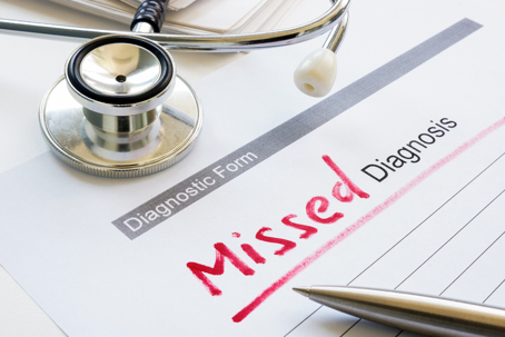 Diagnostic form with a stethoscope and phrase missed diagnosis.